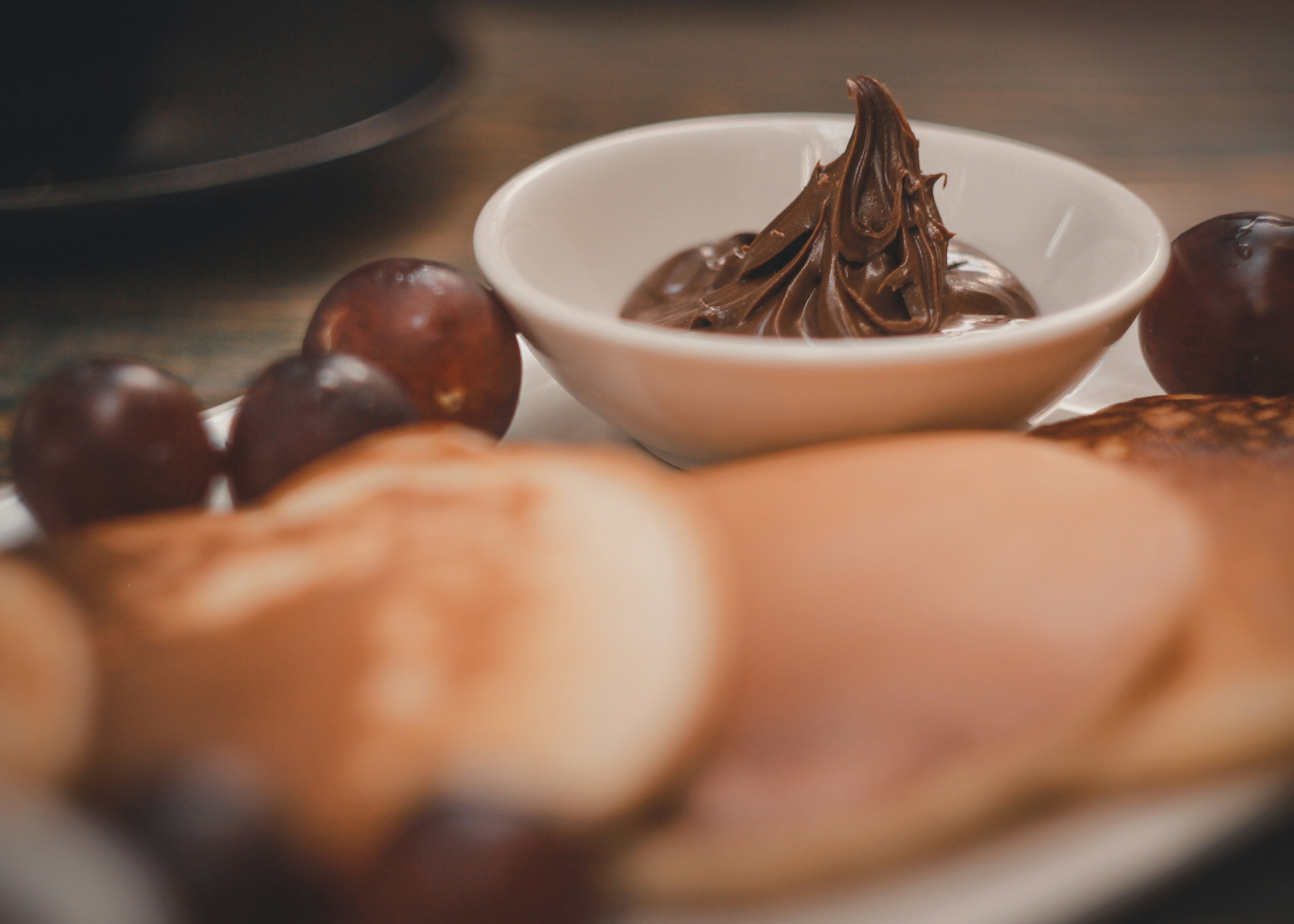 brown and white chocolate on white ceramic bowl